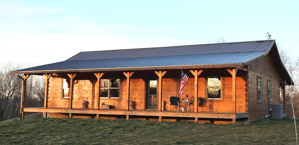 Photo of The Carney log cabin -- a traditional log cabin single story home